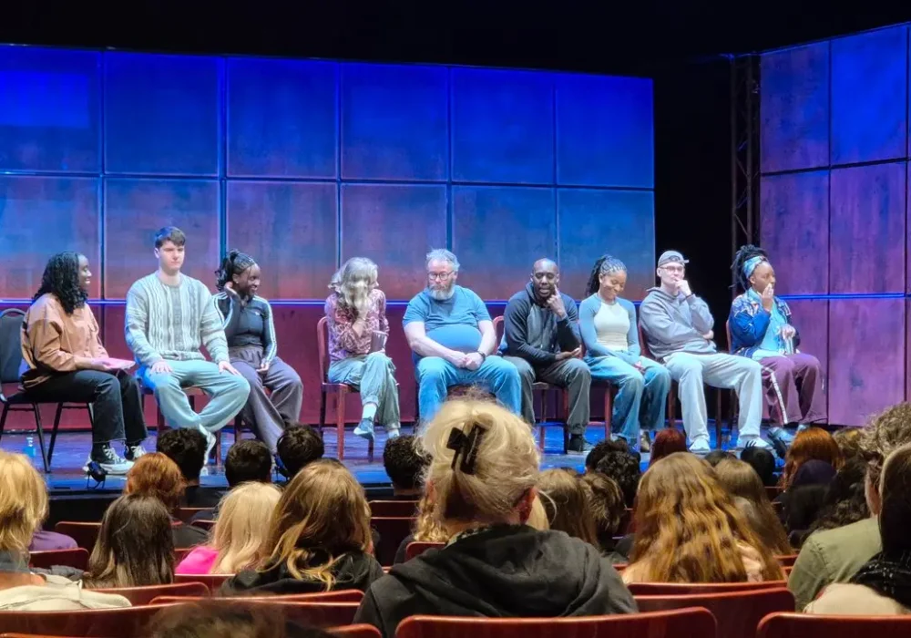 The cast for Noughts and Crosses sat on a chairs on the stage for a post-show discussion.